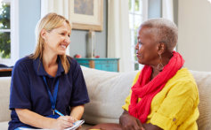 senior woman talking to her caregiver